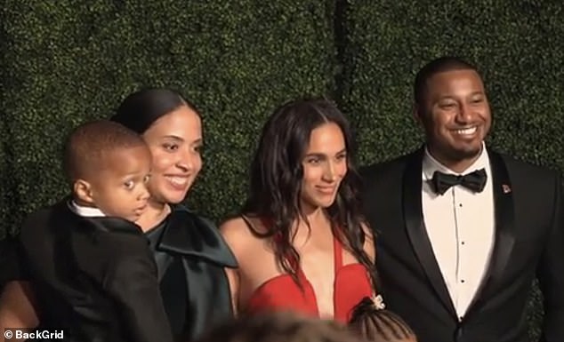 Sweet footage shows Meghan Markle greeting a family at last night's event before joking to a little boy about being up so late