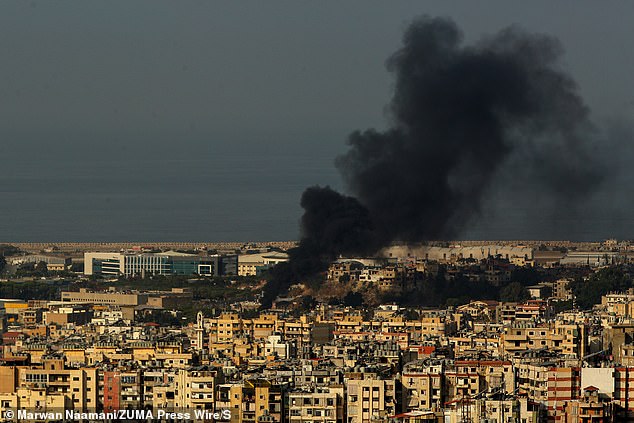 Black smoke rises over Beirut's southern suburbs. Israel launched attacks on Hezbollah's main stronghold and the southern city of Nabtaiyeh, where the country holds sway, after Prime Minister Benjamin Netanyahu rejected calls for a ceasefire.