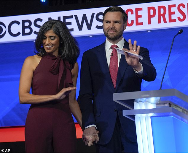 Republican vice presidential candidate Sen. JD Vance, R-Ohio, waves at the podium as he stands with his wife Usha Vance,