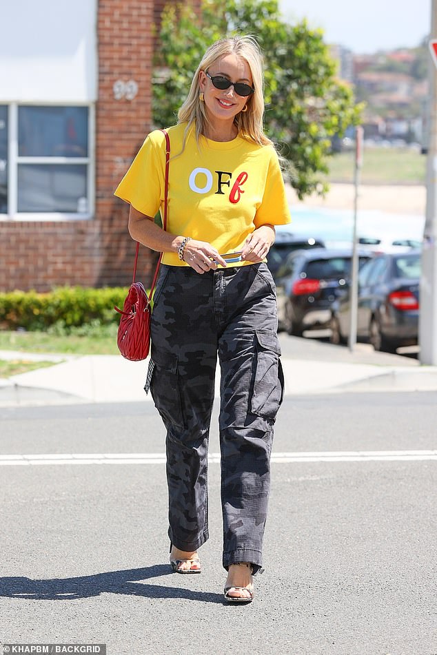 Jackie 'O' Henderson proudly mocked best friend Pip Edwards' fashion label on Tuesday. The radio star, 49, wore baggy Ksubi camouflage trousers as she grabbed a cup of coffee in North Bondi