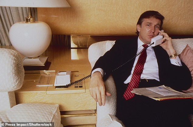 Trump is pictured making a phone call aboard the Trump Princess in 1988