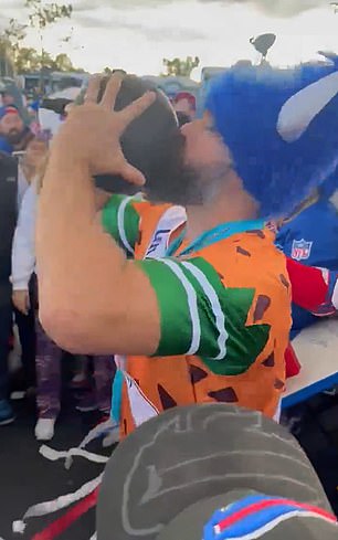 Jason Kelce drinks outside MetLife Stadium