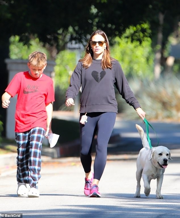 Jennifer Garner, 52, enjoyed some one-on-one time with her son Samuel, 12, and their pet during a casual stroll through their Brentwood neighborhood in Los Angeles