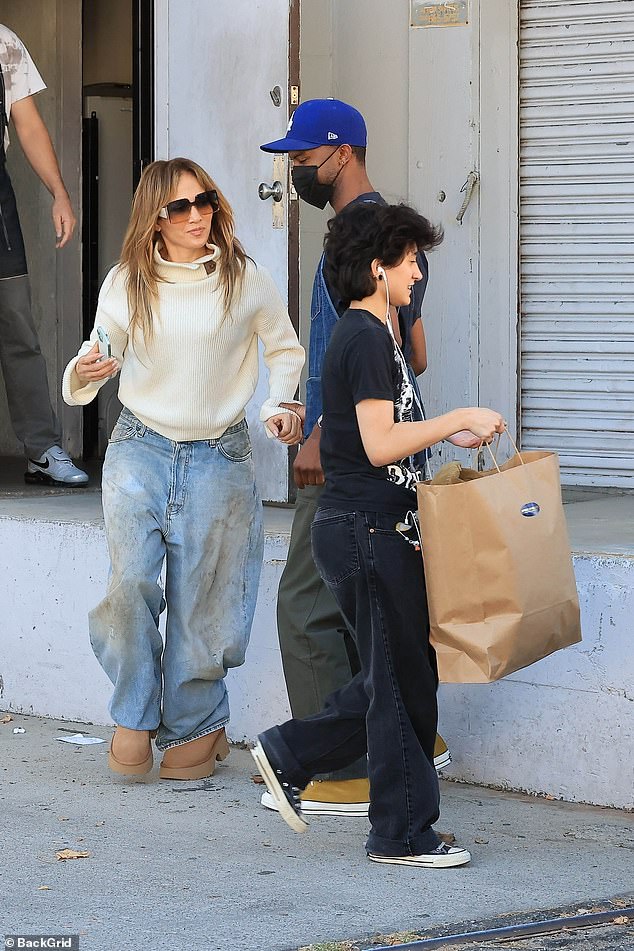 Jennifer Lopez, 55, proved she's a master of casual-cool style on Wednesday during a family shopping trip in Los Angeles with her child Emme