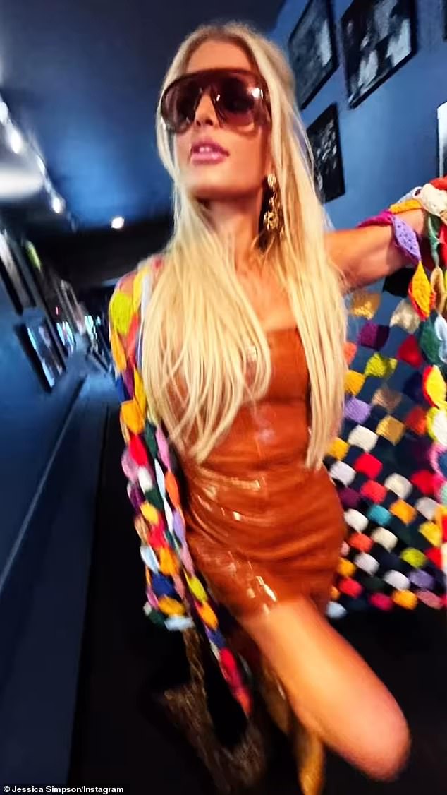 Jessica Simpson showed off her slim 6-foot frame in a brown leather minidress in a recording studio Tuesday for her captured combined 15.1 million social media followers