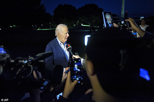 President Joe Biden talks to reporters as he arrives at the White House in Washington