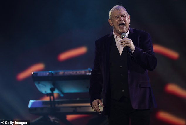 Legendary Australian singer John Farnham's voice can be heard for the first time after he underwent surgery for oral cancer. Pictured performance in 2020