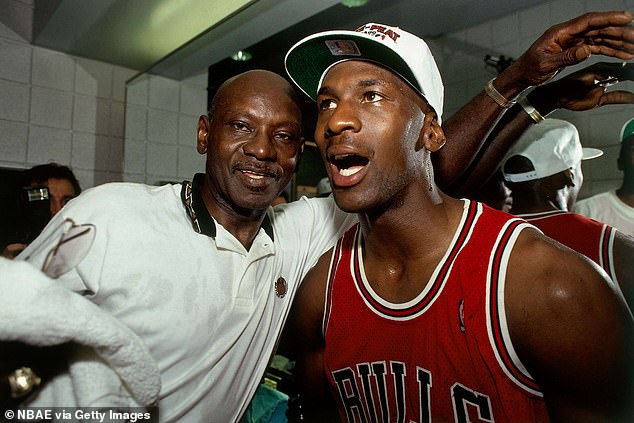 Michael Jordan celebrates winning an NBA championship with his father James