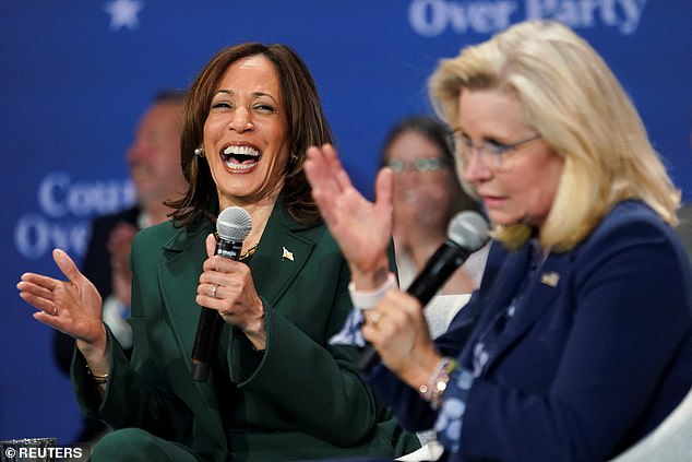 Democratic presidential candidate Kamala Harris and former U.S. Rep. Liz Cheney react during a conversation Monday evening in Brookfield, Wisconsin