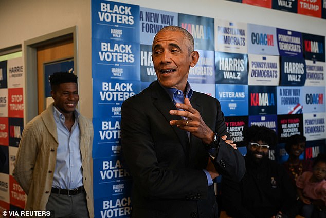 Former U.S. President Barack Obama talks to supporters at a campaign office in East Liberty ahead of a rally in support of Vice President Kamala Harris in Pittsburgh.