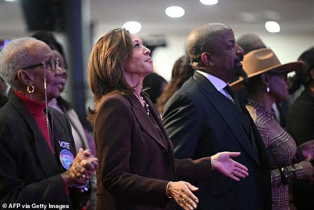 Harris claps during a service at the Church of Christian Compassion in Philadelphia, Pennsylvania, just nine days until the 2024 presidential election