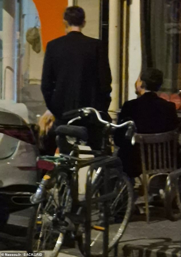 Kate Moss fell awkwardly while enjoying a cigarette outside a restaurant in Paris on Sunday evening