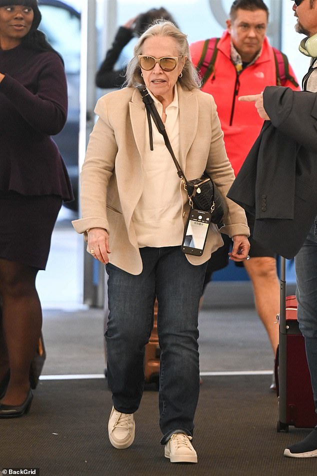 Kathy Bates, 76, showed off her dramatic 100-pound weight loss on Friday as she headed to New York's LaGuardia Airport