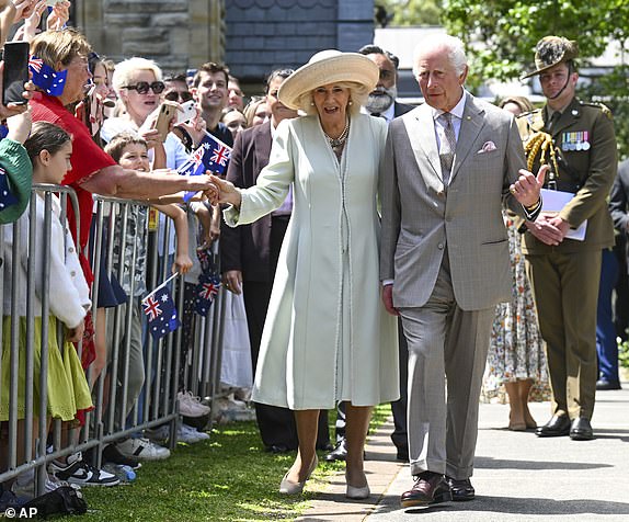 Britain's King Charles and Queen Camilla greet well-wishers as they leave St Thomas' Anglican Church in Sydney, Sunday, Oct. 20, 2024. (Dean Lewins/Pool Photo via AP)