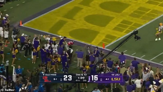 LSU's Mason Taylor was pushed by an Ole Miss defender as he reached the end zone for a touchdown