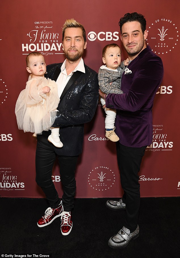 The longtime couple — who have been married since 2014 — welcomed their two children via surrogate in 2021; pictured November 2022 in Los Angeles