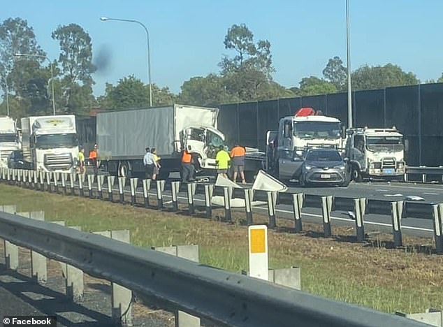 Two trucks and a car collided on the Logan Motorway, south of Brisbane, just before 6.30am on Tuesday.