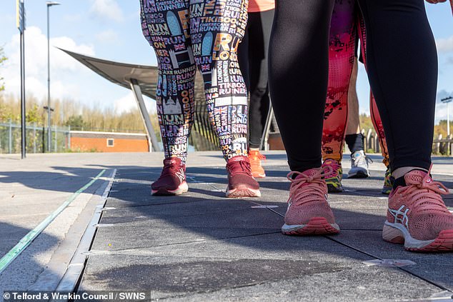 The floor of the pub will be fitted with tiles from Pavegen (photo), which create between two and four joules of force with every step. Pictured: Pavegen tiles installed at Telford Central Station