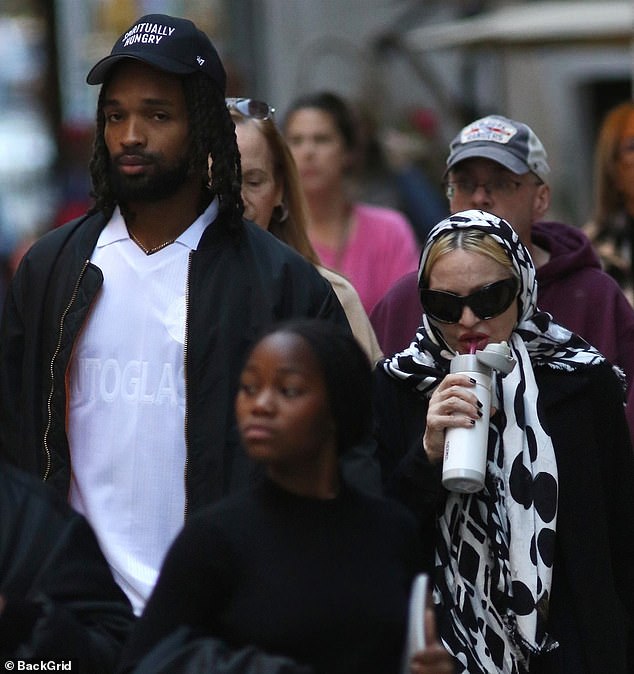 Madonna, 66, looked almost unrecognizable as she enjoyed a quiet outing with her 28-year-old boyfriend Akeem Morris and twin daughters, Stella and Estere, 12, in New York on Saturday