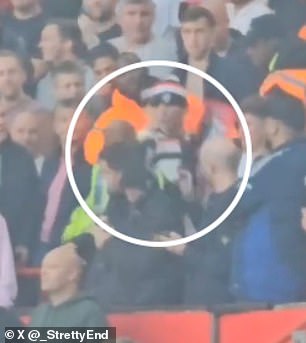 A 38-year-old supporter (circled with beanie) was arrested at Old Trafford on Saturday