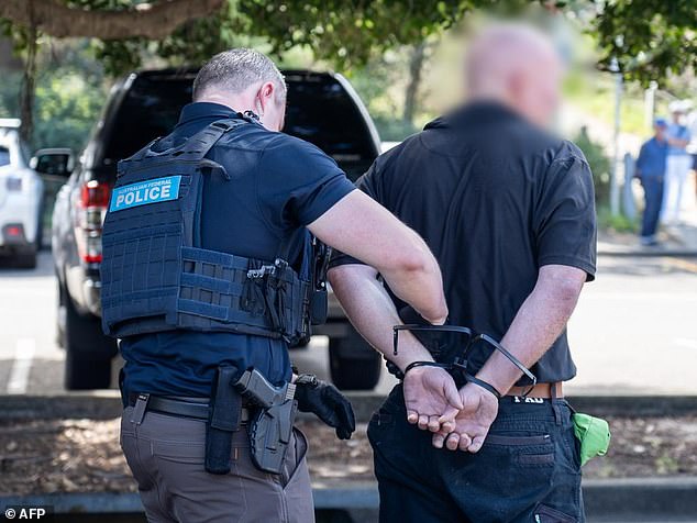 A man has been arrested (pictured) in the car park of the Maroubra Surf Club in Sydney's east after an alleged attempt to pick up 60kg of methamphetamine worth more than $50 million