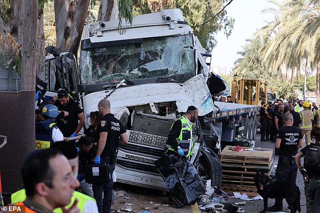 Israeli police investigate the scene of a truck ramming outside the Glilot military base near Tel Aviv, Israel, October 27, 2024