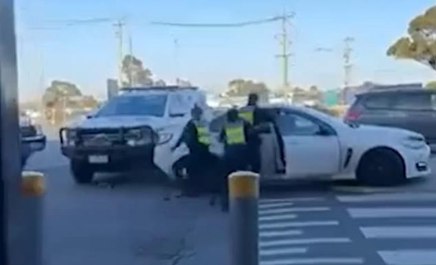 Three police officers desperately tried to drag the man from behind the wheel of the car, but he could not be stopped