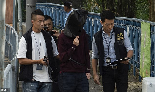 The 34-year-old unnamed man and his wife were both arrested at West Kowloon Train Station on Tuesday in connection with the crime. A man, believed to be a British businessman, was escorted by police on Tuesday for a video reconstruction of the crime scene