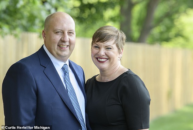 Curtis Hertel and his wife Elizabeth Hertel. The couple married in 2010, four years before the Democrat last accessed his AdultFriendFinders.com account.