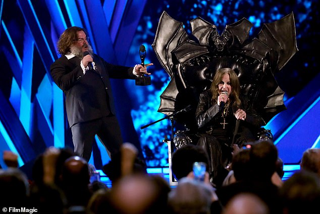 Ozzy, who is battling Parkinson's disease, took the stage on a throne decorated with bat wings