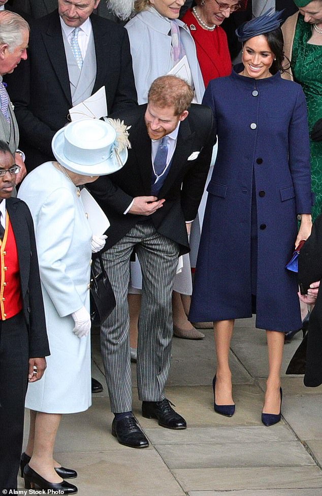 Prince Harry, with his wife Meghan, in conversation with the late Queen Elizabeth outside St George's Chapel after the wedding of Princess Eugenie and Jack Brooksbank in 2018