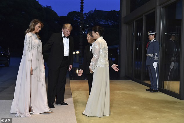 Donald and Melania Trump are greeted by Japanese Emperor Naruhito and Empress Masako upon their arrival at the Imperial Palace for a state banquet in May 2019