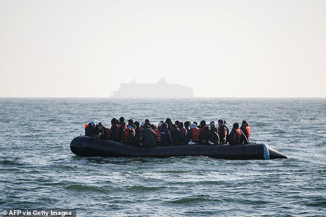 A photo from May shows migrants waiting for rescue after their boat's generator broke down in French waters