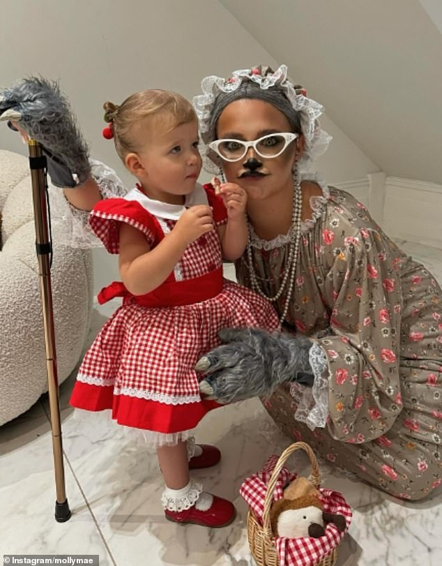 Molly-Mae Haag, 25, looked unrecognizable as she dressed up as Grandma Wolf, while daughter Bambi, 21 months, wore a Little Red Riding Hood costume on Wednesday