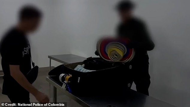 This is the moment Colombian police pounce on a suspected British cocaine smuggler and find two kilos of the drug hidden under a Mexican sombrero in his suitcase as he tries to leave the country