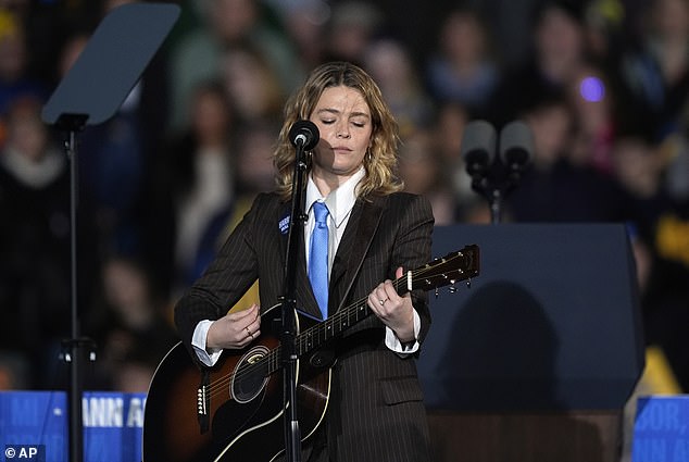 Singer Maggie Rogers waves to the crowd during a rally for Kamala Harris where she performed. She said nothing is more important than the elections right now