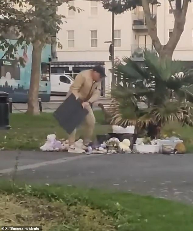 Gruesome footage shows a man callously vandalizing a memorial in Britain to the victims of the October 7 massacre