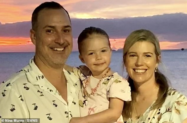 Nina Munro, 41, pictured with her husband Ken and daughter, drank about four liters of water a day in an attempt to 'flush away' a cold - unaware she was 'slowly drowning' herself