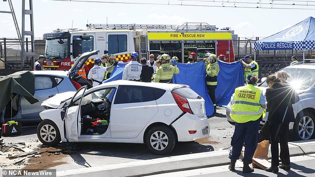 A motorcyclist arrested at the scene of a fatal multi-vehicle crash on the Sydney Harbor Bridge (pictured) allegedly struck a police officer while speeding away from officers