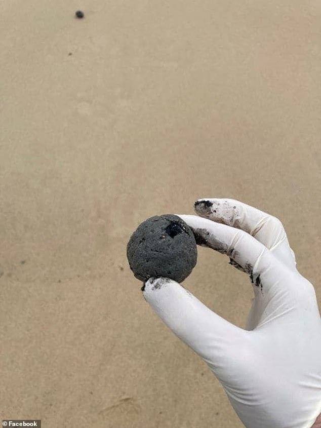 Mysterious black balls that washed up on one of Australias