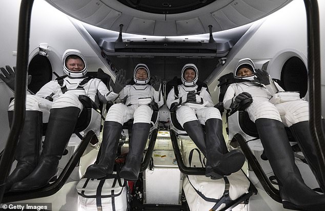 This NASA image shows Roscosmos cosmonaut Alexander Grebenkin (left) NASA astronauts Michael Barratt (second from left) Matthew Dominick (second from right) and Jeanette Epps (right) in the SpaceX Dragon Endeavor spacecraft aboard the SpaceX recovery ship MEGAN, shortly after landing in the Gulf of Mexico off the coast of Pensacola, Florida on October 25, 2024