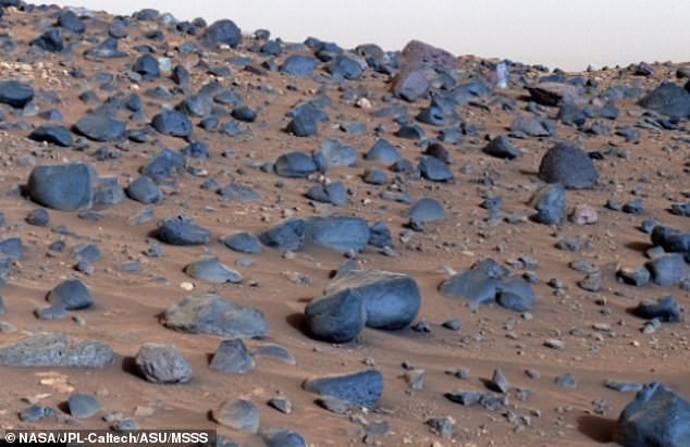 Most of the blue-black rocks you see on the surface of Mars, such as those on 'Mount Washburn', are volcanic basalt (above). The rocks are similar to the volcanic rocks beneath Earth's oceans