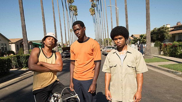 Damson Idris, 33, issued a stark warning to anyone looking to dress as his infamous character from Snowfall for Halloween this year (pictured with Malcom Mays, left, and Isaiah John, right)