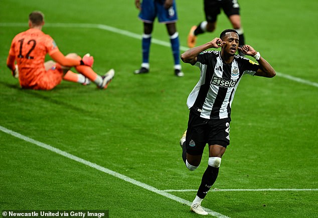 Joe Willock (right) celebrates Newcastle's second goal courtesy of Man City's Axel Disasi