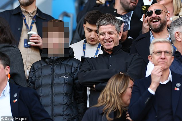 Noel Gallagher and his son Donovan spent his Saturday afternoon cheering on their beloved football team Manchester City at the Etihad Stadium