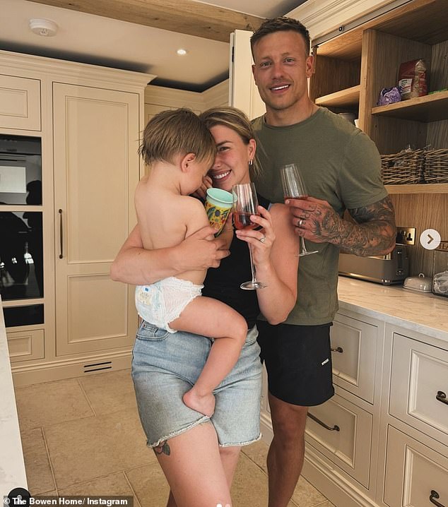 She appeared to make the most of her time off from motherly duties as she went on holiday without her husband Alex, 32, and their son Abel, two (pictured with Alex and Abel)