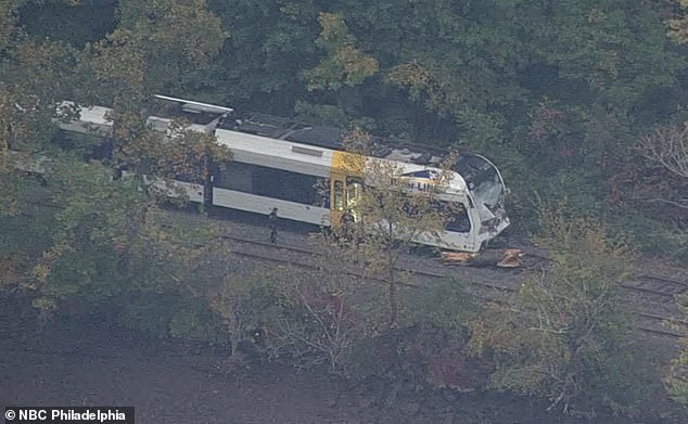 There were 45 passengers aboard the River Line train this morning. Pictured: The fallen tree on the track near Mansfield Township that caused the crash just before 6 a.m. Monday