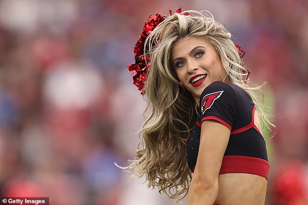 The Arizona Cardinals cheerleader performs during the NFL game at State Farm Stadium