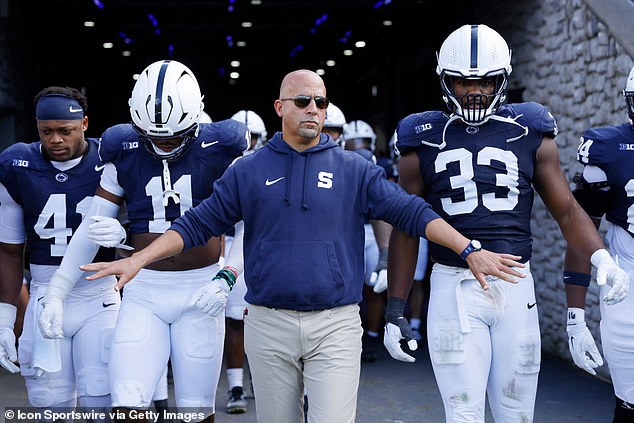 Penn State head coach James Franklin walks onto the field with his players on October 5