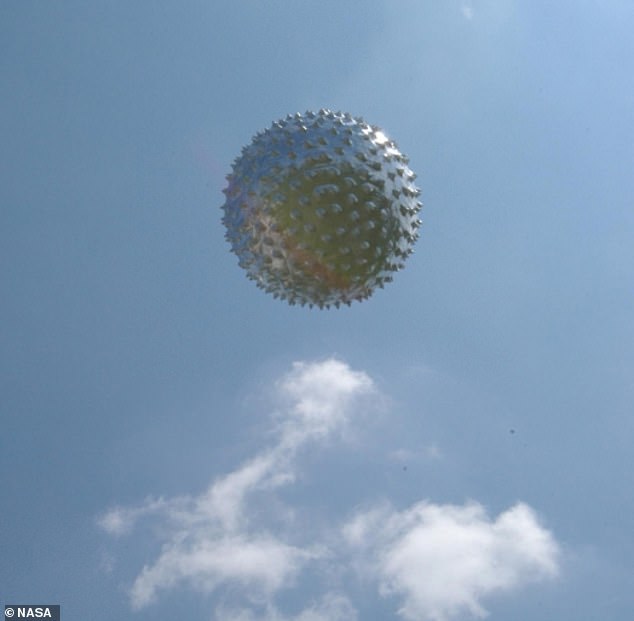 A new allegedly leaked classified report details an incident in which a swarm of 'sphere' UFOs surrounded an F-22 stealth Raptor and forced it off course. Above, a weather balloon floats through the sky after being released from the Cape Canaveral weather station in Florida